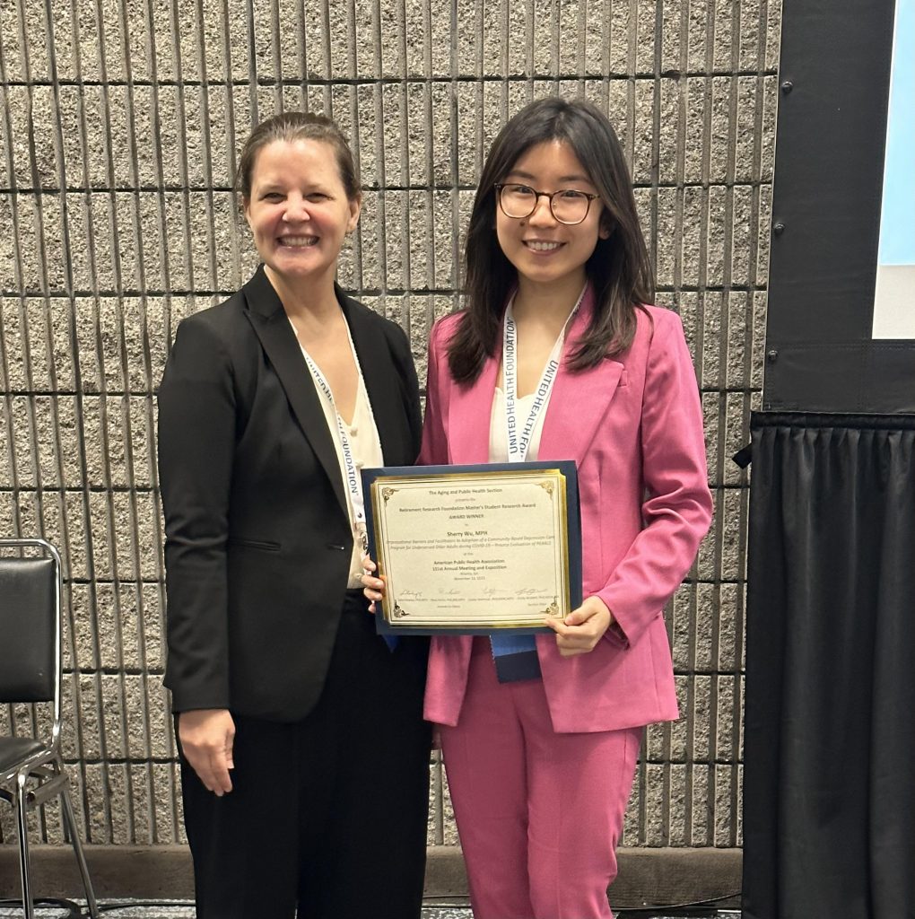 Wu with her award and Dr. Emily Nicklett of the APHA chair