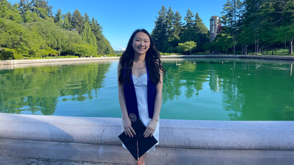 Amanda Hoang on the University of Washington campus (image background width expanded with AI to accommodate website format).
