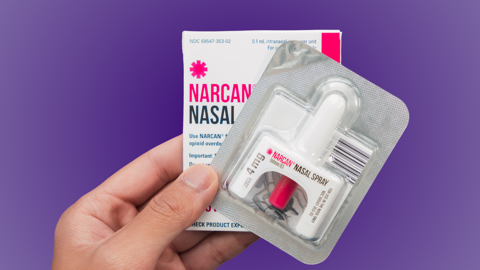 Hand holds Narcan