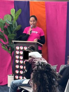 Jae Williams speaks at a podium