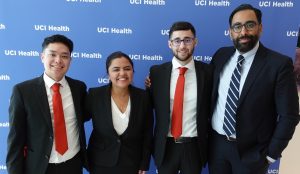 Vince Da with case competition team and director of MHA programs Neil Sehgal